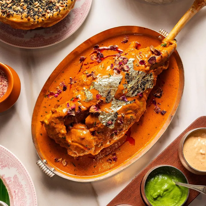 Assorted curries and breads laid out for sharing